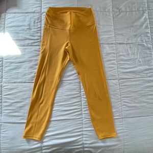 Yellow Under Armour pocket workout leggings